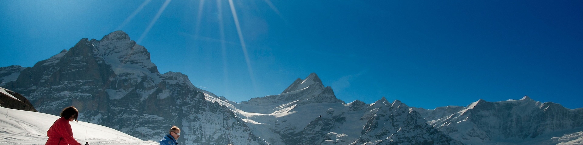 Grindelwald featuring snow and snow shoeing as well as a small group of people