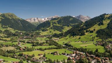 A mountainous landscape with a small village nestled in the valley.