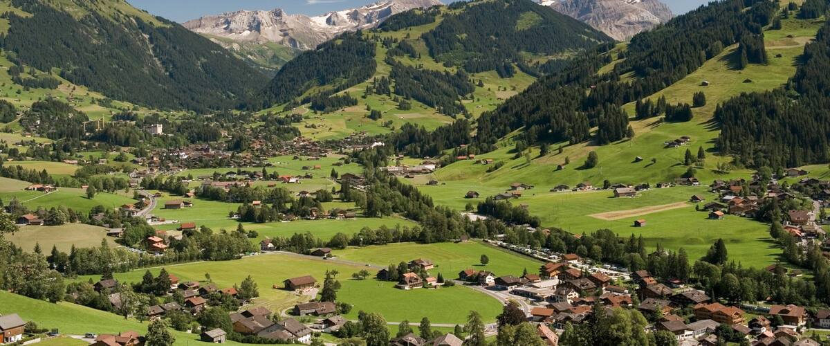 A mountainous landscape with a small village nestled in the valley.