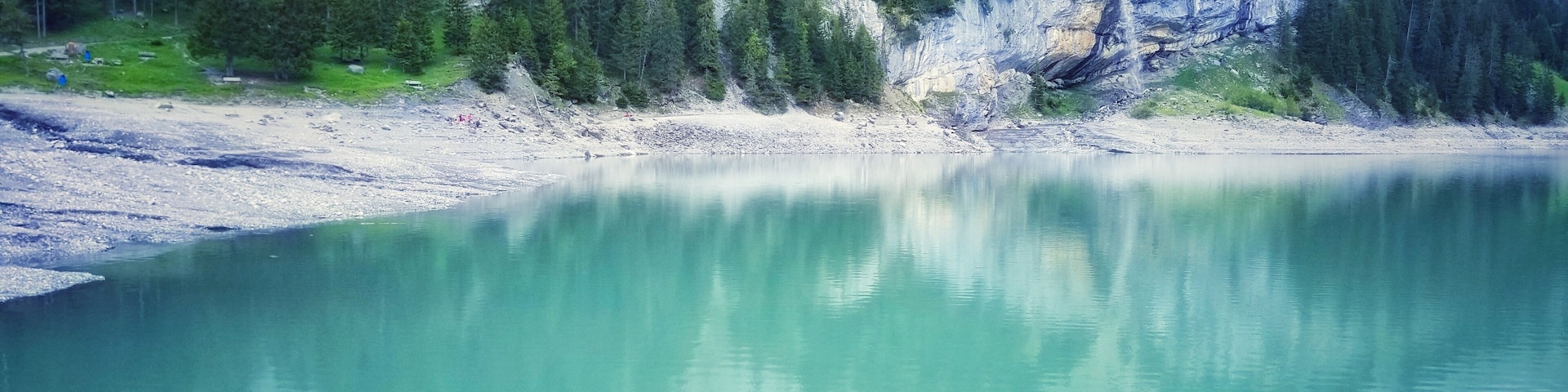 Oeschinen Lake is a lake in Bernese Oberland the Bernese Oberland, Switzerland, 4 kilometres east of Kandersteg in the Oeschinen valley. At an elevation of 1,578 metres, it has a surface area of 1.1147 square kilometres.