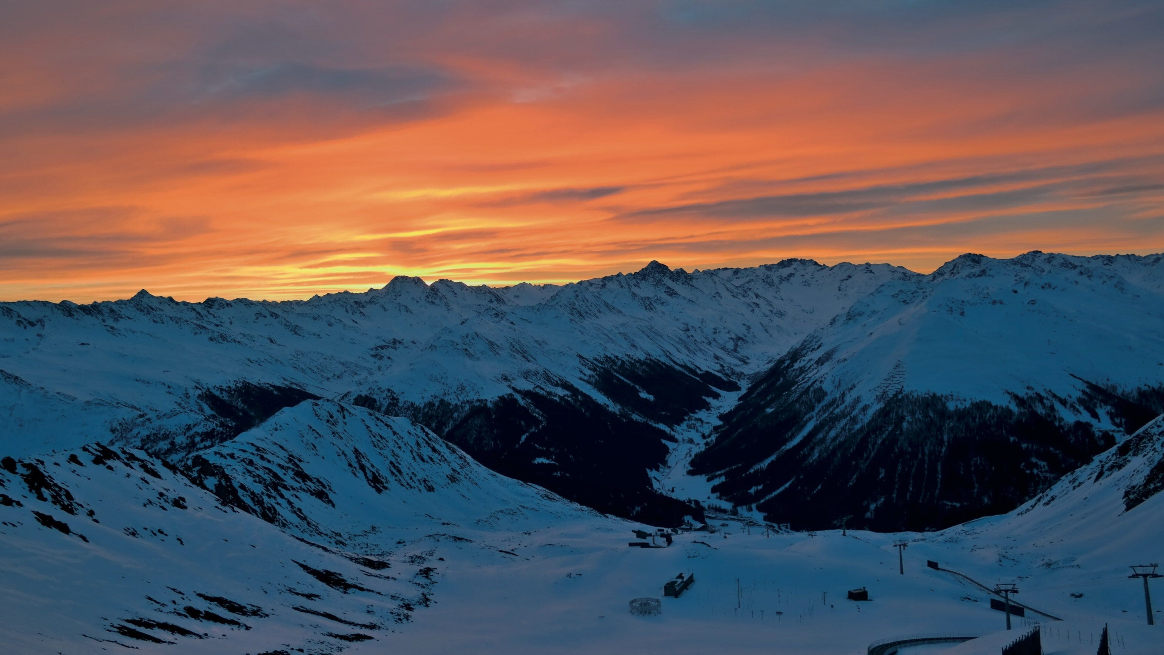 Klosters-Serneus which includes landscape views, a sunset and snow