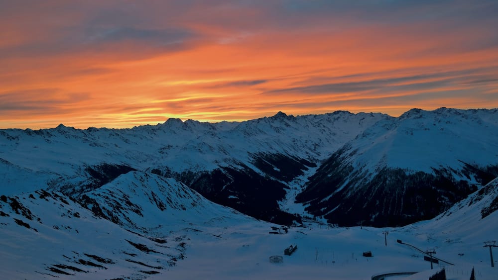 Klosters-Serneus which includes landscape views, a sunset and snow
