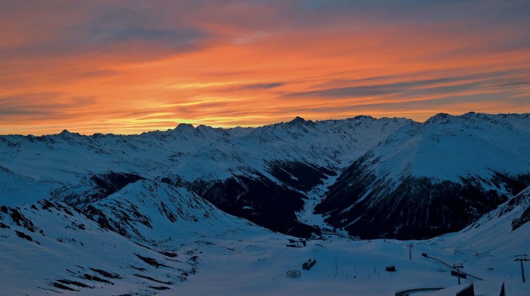 Klosters-Serneus which includes landscape views, a sunset and snow