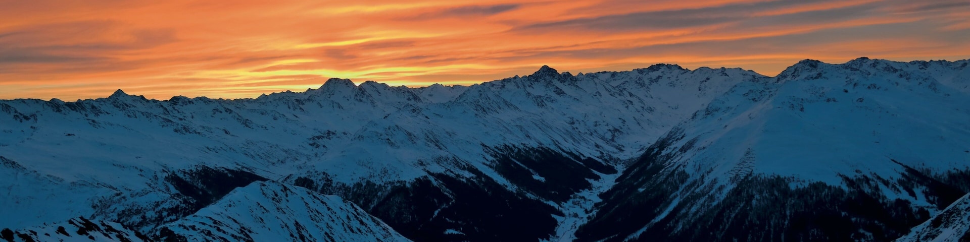 Klosters-Serneus which includes landscape views, a sunset and snow