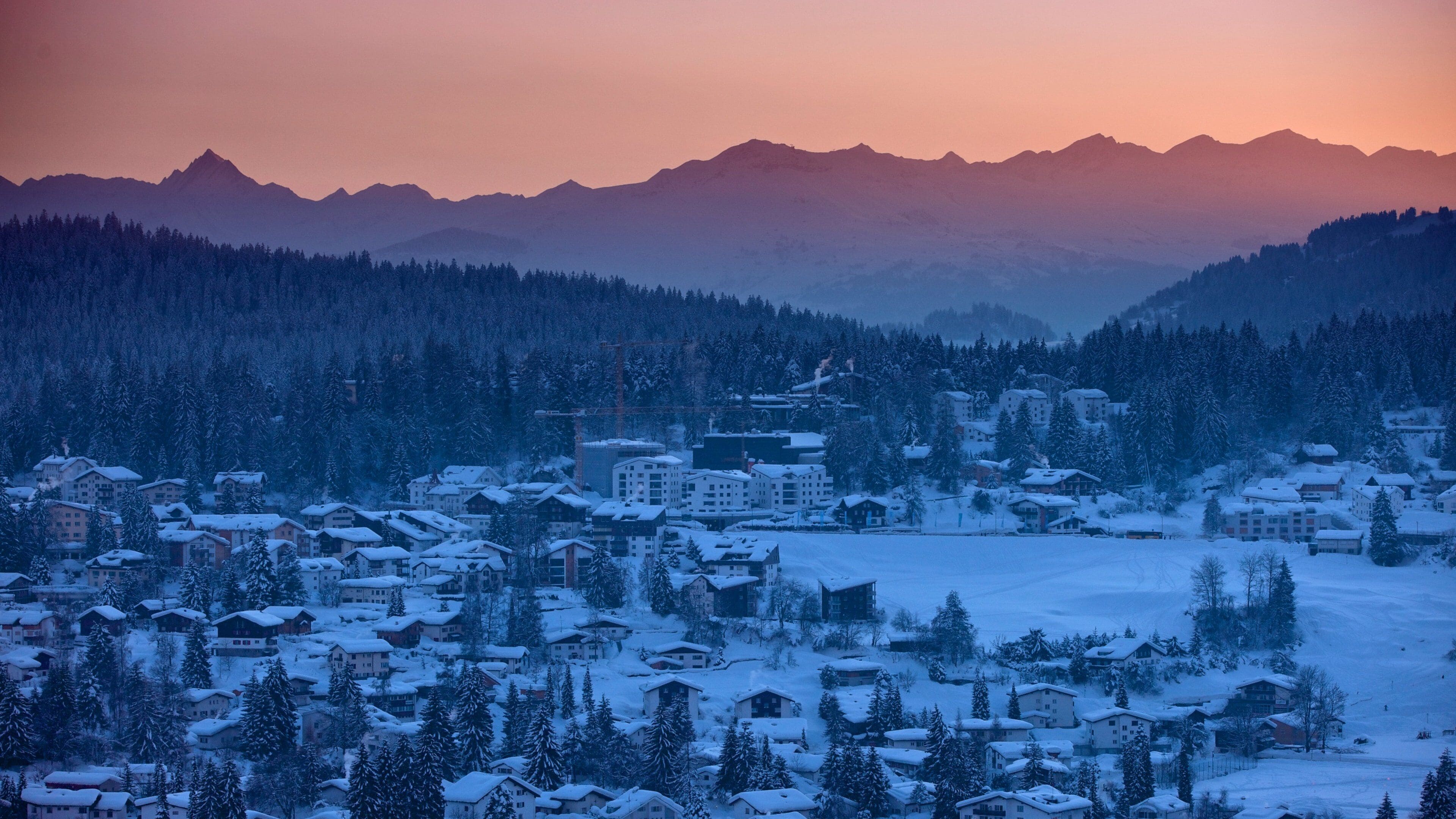 Laax which includes a sunset, snow and tranquil scenes