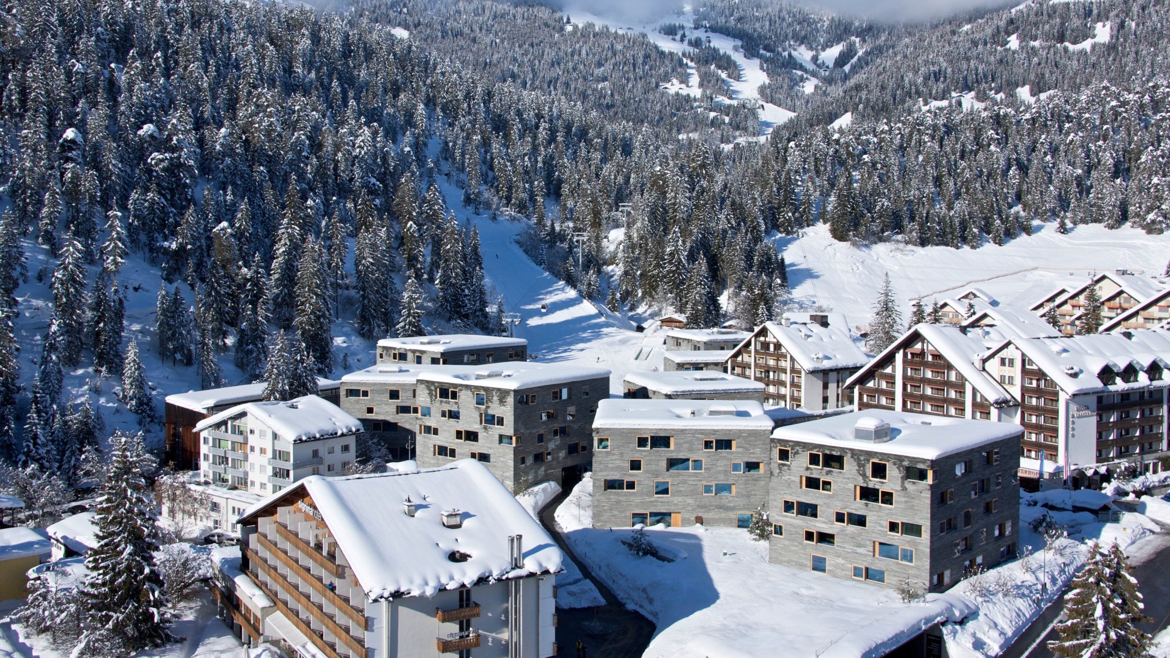 Flims which includes snow, landscape views and a small town or village
