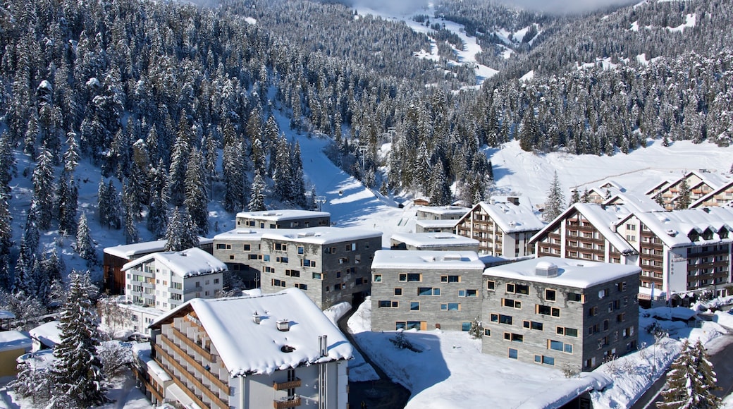 Flims which includes snow, landscape views and a small town or village