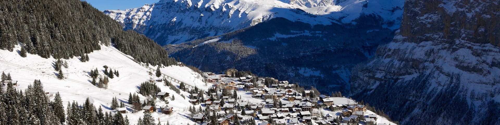 Muerren featuring snow, mountains and a small town or village