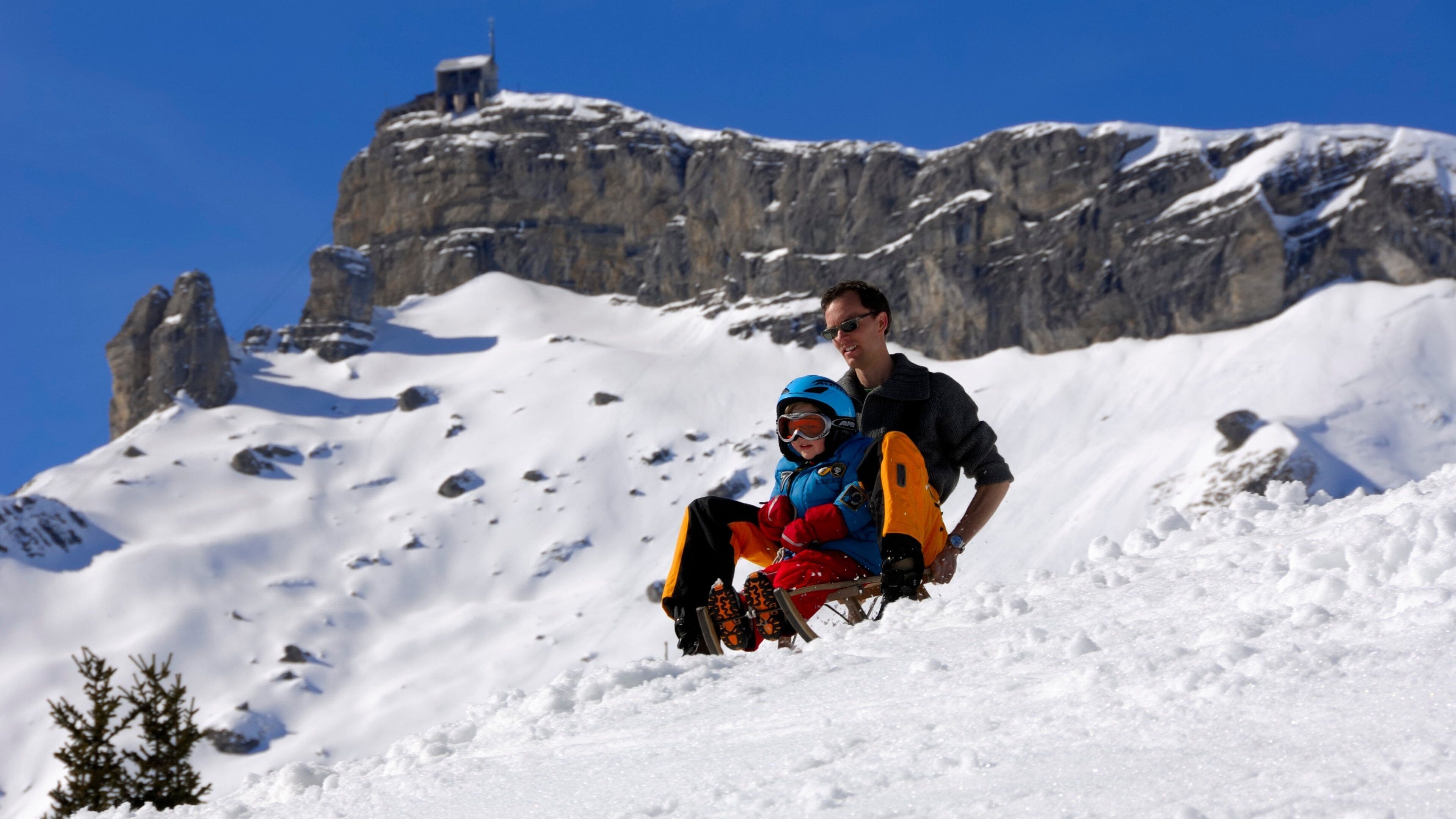 Muerren which includes snow tubing and snow as well as a family