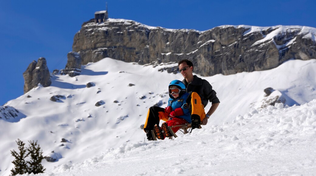 Muerren which includes snow tubing and snow as well as a family
