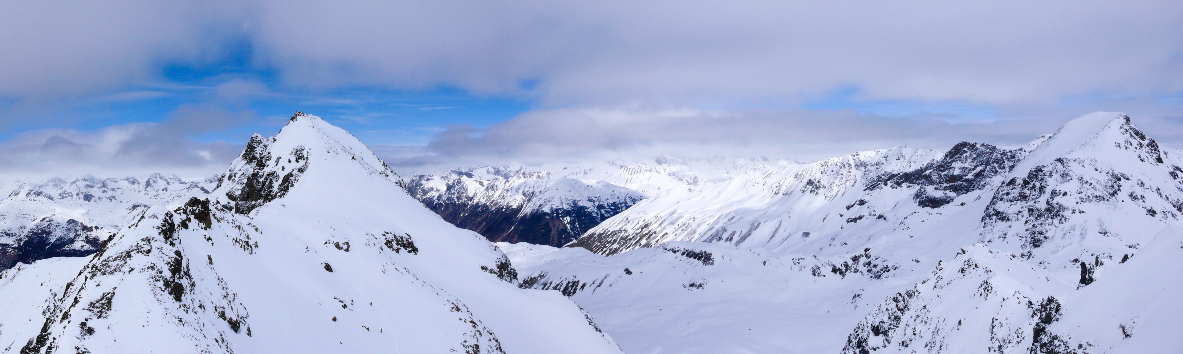 panorama winter mountain landscape with peaks and the lakes near St. Moritz in the background