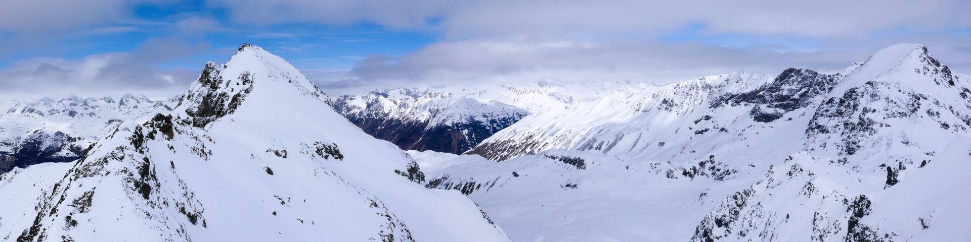 panorama winter mountain landscape with peaks and the lakes near St. Moritz in the background