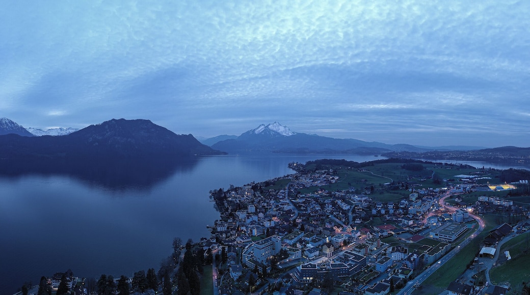 Weggis town, Switzerland. Lake Lucerne. Alps mountains in the snow. Aerial view.