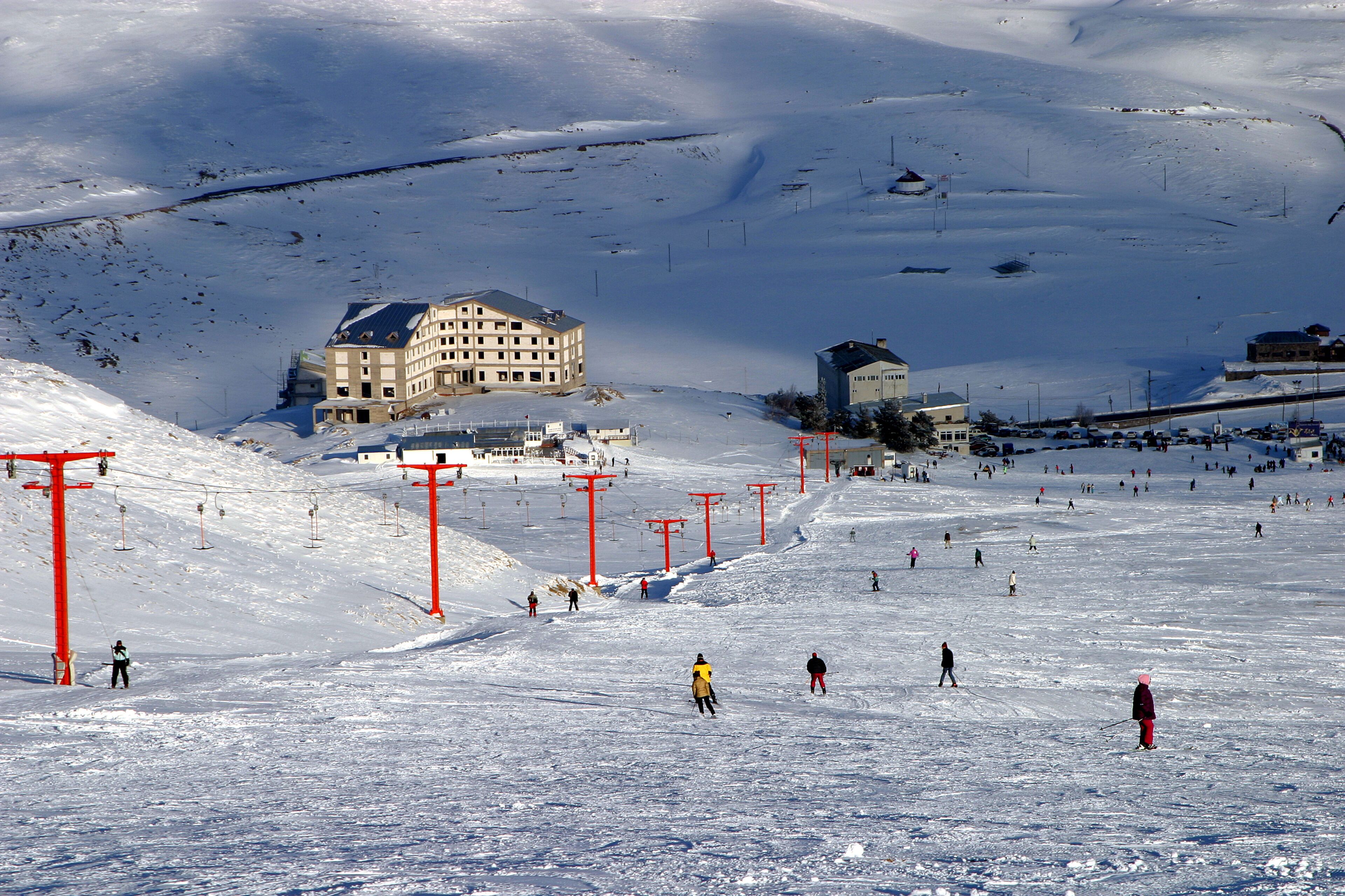 People skiing at Mount Erciyes ski area in Kayseri, Turkey. Mount Erciyes ski area is one of the longest slope in Turkey.