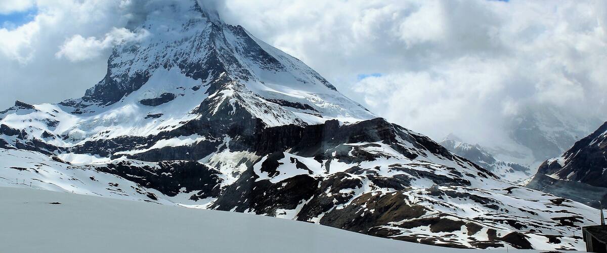 I took this in Zermatt, Switzerland on May 29th :). This was taken on the train from Gornergrat to Zermatt center. So the map location is only approximate. 
I had a great, short trip to Switzerland after a likewise trip to Madeira and Lisbon!  And this day trip to see Matterhorn being the final day. Matterhorn being one of the most epic mountains in all of Europe and also one of the highest. It stands at 4,478 m (14,692 ft) and really does look it!
I took the train up to Gornergrat (which is at 3,135 m/10,285 ft).. And then the train back down to the Zermatt center. The view from Gornergrat was amazing, too, but the Matterhorn top was enshrouded in clouds. Going back the clouds finally started to move! And I got some pretty decent shots. Also, it was a thrilling experience being up there at Gornergrat. Despite it being late Spring it was very much like Winter! The temperature was supposedly around -6 C/21.2 F. And obviously so much snow all around. I got great views of the glacier, too. Inside the train it was much warmer, though ;). I then took the train back to Visp where I was staying. And the next day my trip was over. But was a great way to end an epic 2 weeks! And especially happy to see something I've dreamed of for so long - the majestic Matterhorn.