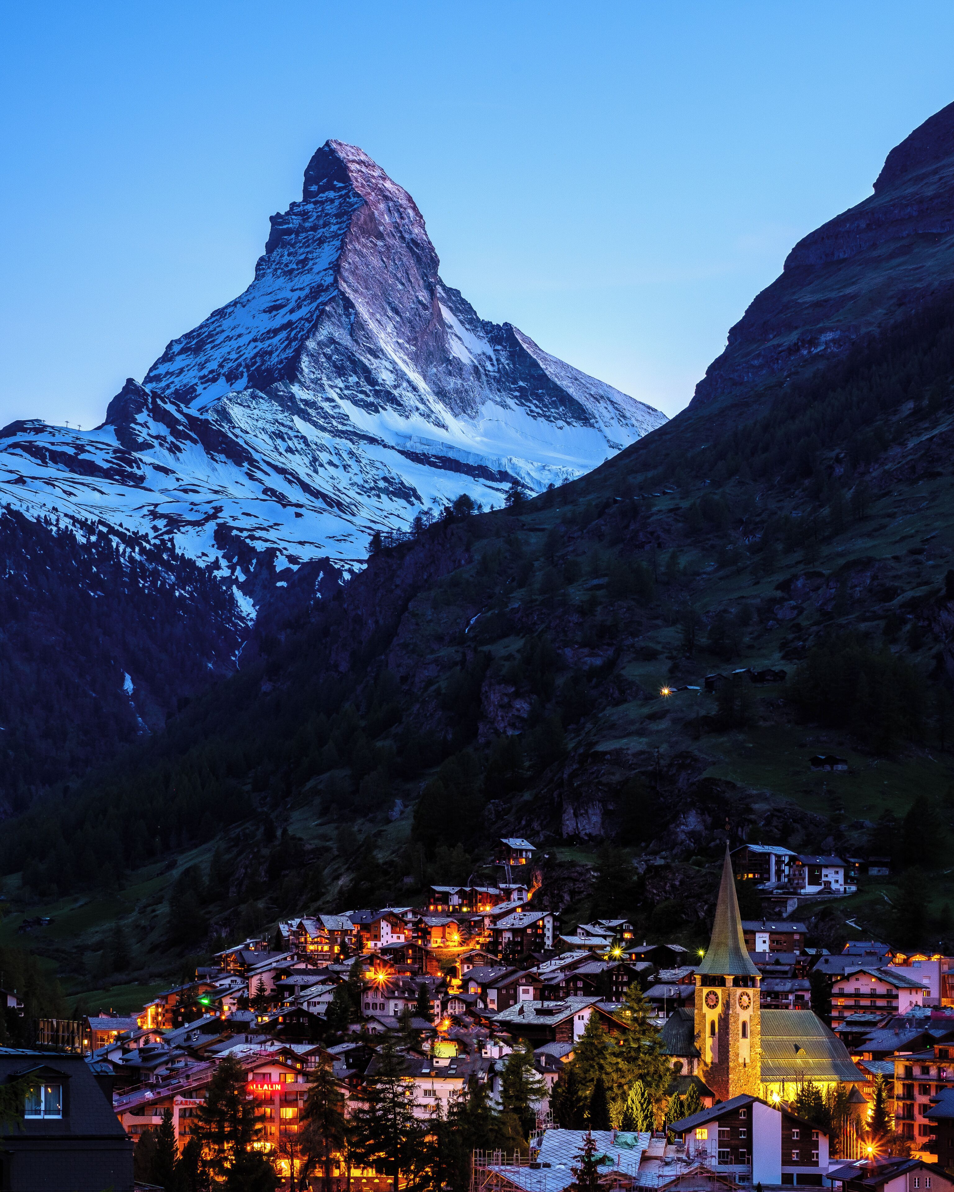 This photo is taken from the Riedweg. It's great for sunset and blue hour photos since it allows to frame both the village and the Matterhorn.