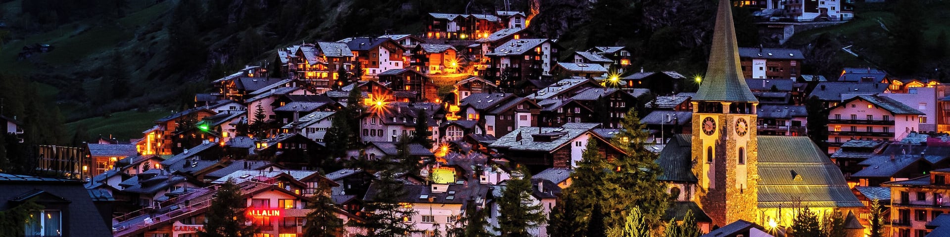 This photo is taken from the Riedweg. It's great for sunset and blue hour photos since it allows to frame both the village and the Matterhorn.