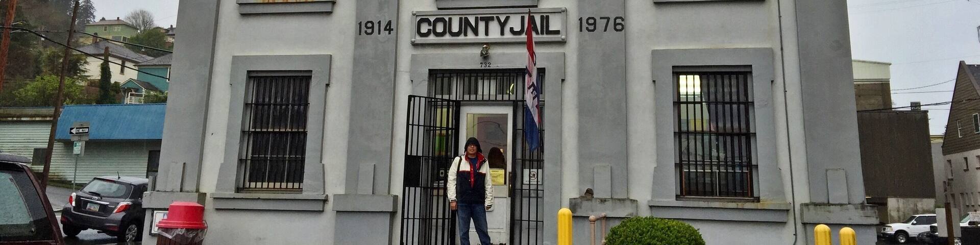 The Oregon Film Museum building with a sign reading "COUNTY JAIL" and the years 1914 and 1976.