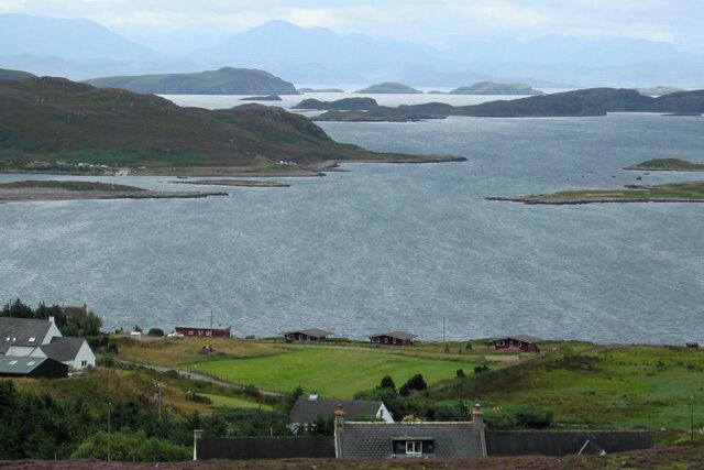 Altandhu A view over the shoreline at Altandhu and onwards across Loch an Alltain Duibh to the Summer Isles.