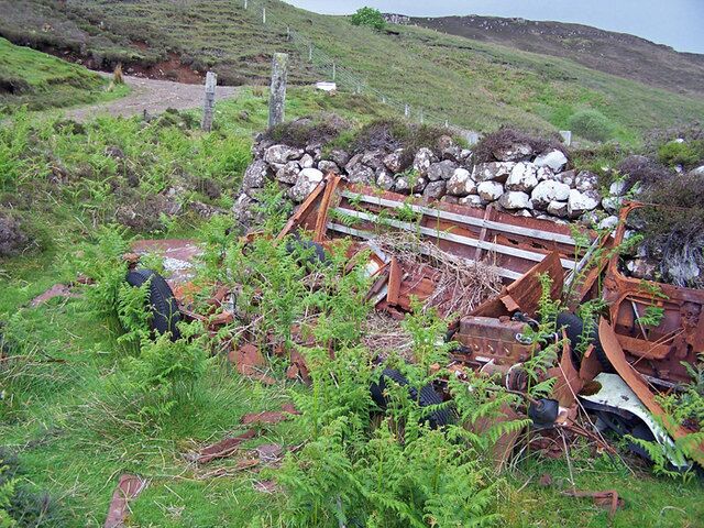 Abandoned vehicle, Lower Ollach Look carefully among the bracken - the four wheels and engine, plus some very decayed body panels are fairly obvious. Largely hidden in this view is the chassis, gearbox, axle and suspension. The vehicle was probably once a 1950's Austin/Morris van. I suspect it will probably lie here until it has been completely absorbed into the hillside on which it stands.