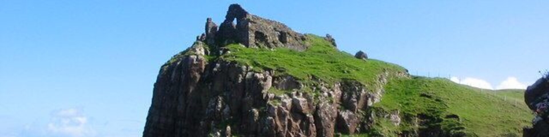 Duntulm Castle. Built in the C13th for the Lord of the Isles, it has a chequered history, having been given to Torquil MacLeod of Lewis it was forcibly retaken by the MacDonalds in 1520. In 1618 it was returned to Sir Rory McLeod, and repairs had to made by the MacDonalds. The estate was confiscated after the 1715 rebellion, but returned in 1726. It was abandoned sometime between then and the 1745 rebellion, whereupon it was dismantled.