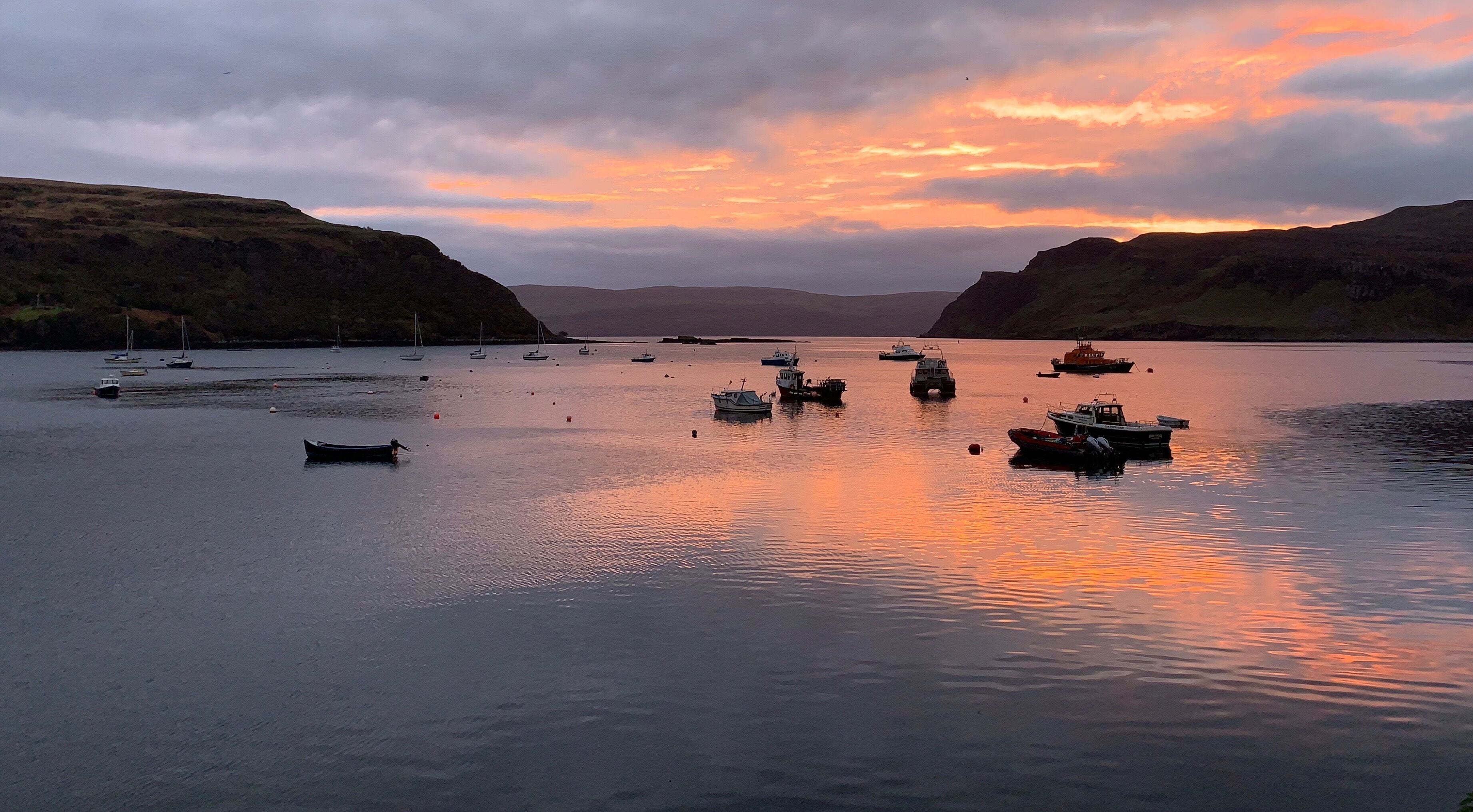 Amazing sunset on the bay of Portree, on the Isle of Skye,  Scotland. 
