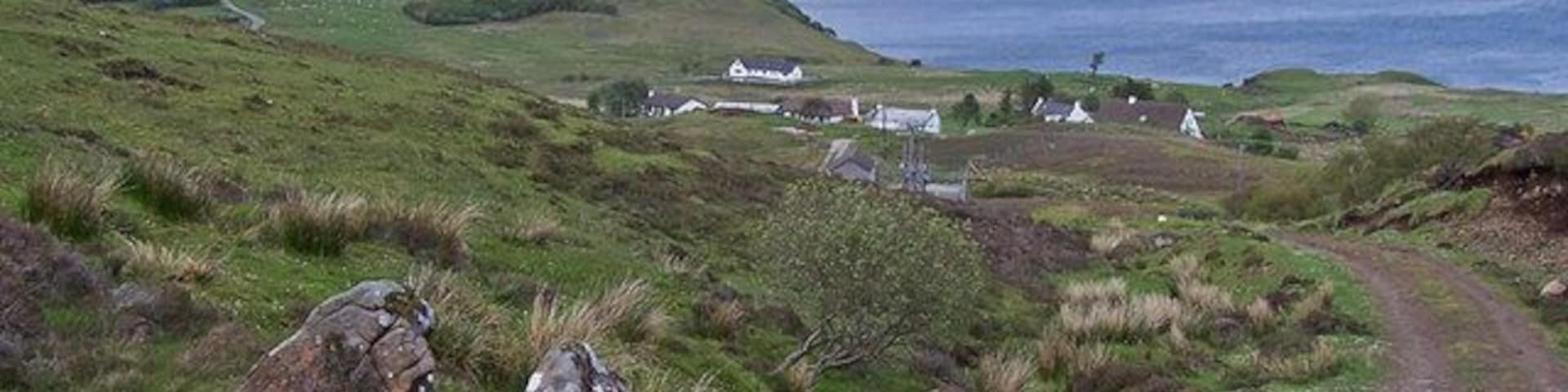 Track towards Lower Ollach The track provides access to the Braes water treatment plant. At the top of the track is a viewpoint at Farquhar's seat, above the Coille Iosal woodland. Beyond, the mountain is Ben Tianaviag.