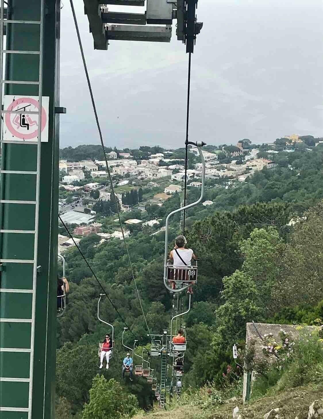 Steep one person chair lift up to the top for AMAZING views. Definitely worth doing. Tip - make friends and share a taxi to Anacapri vs waiting for the bus. So many people in line waiting, and if you fill a taxi it’s roughly the same price or negligible difference that makes it totally worth it.