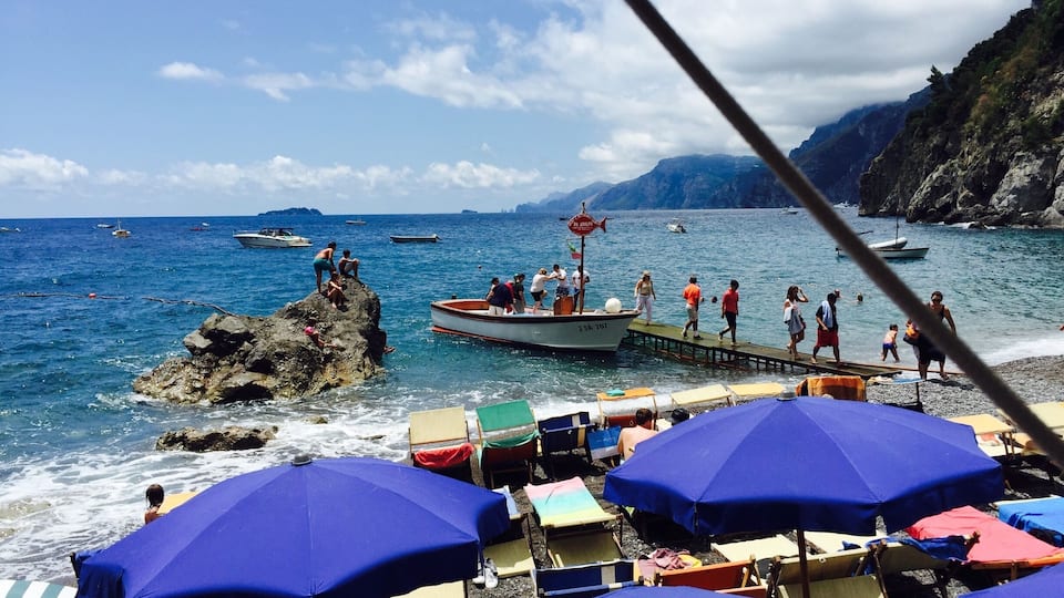 Laid back beach club and restaurant accessible by water taxi from positano. Nice swimming for kids. One of the best lunches I've ever had: mussel soup, homemade spaghetti with pesto, marinated anchovies. And don't forget the chilled peach wine! Come for a great day.