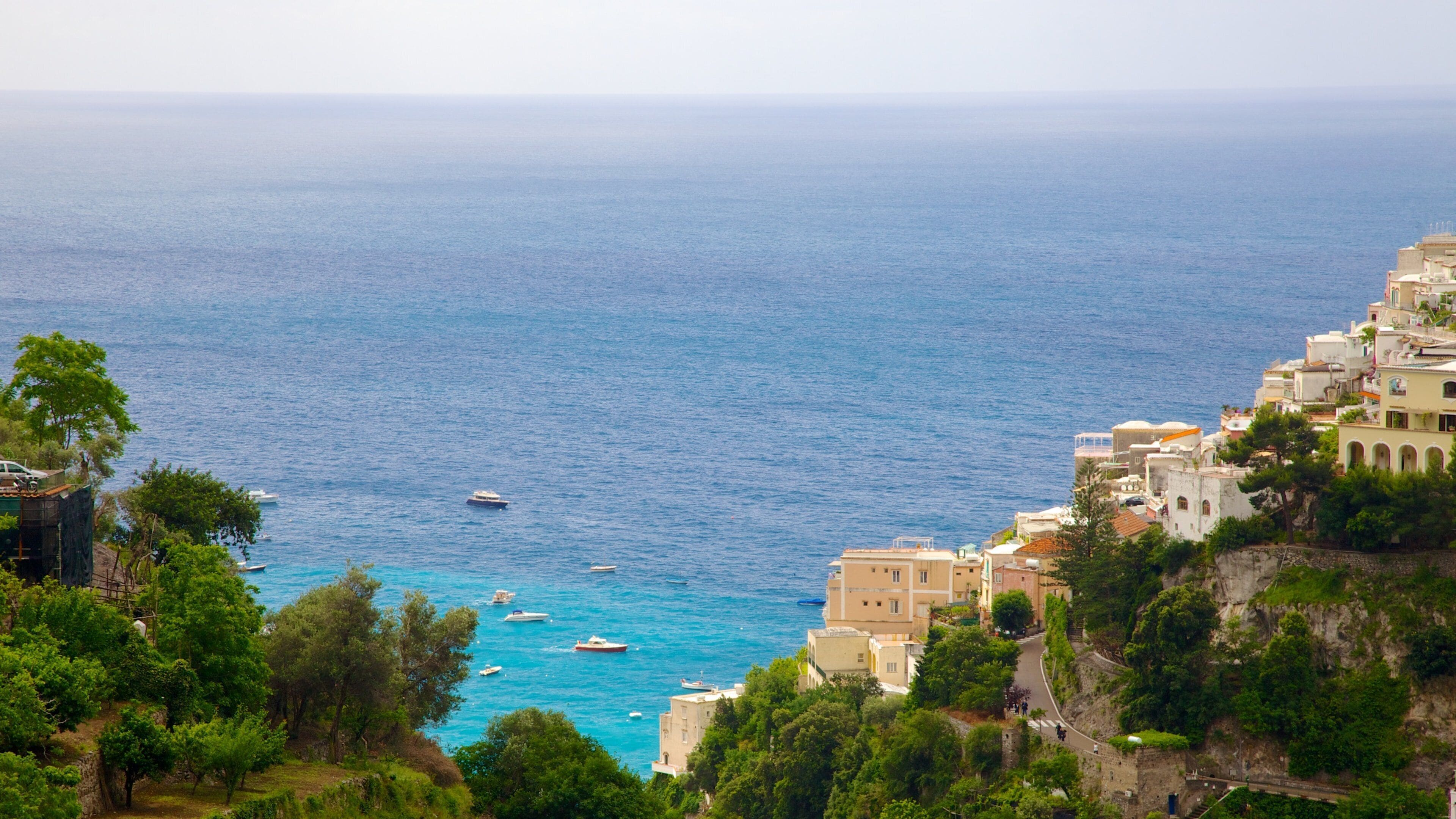 Positano showing general coastal views, a city and mountains