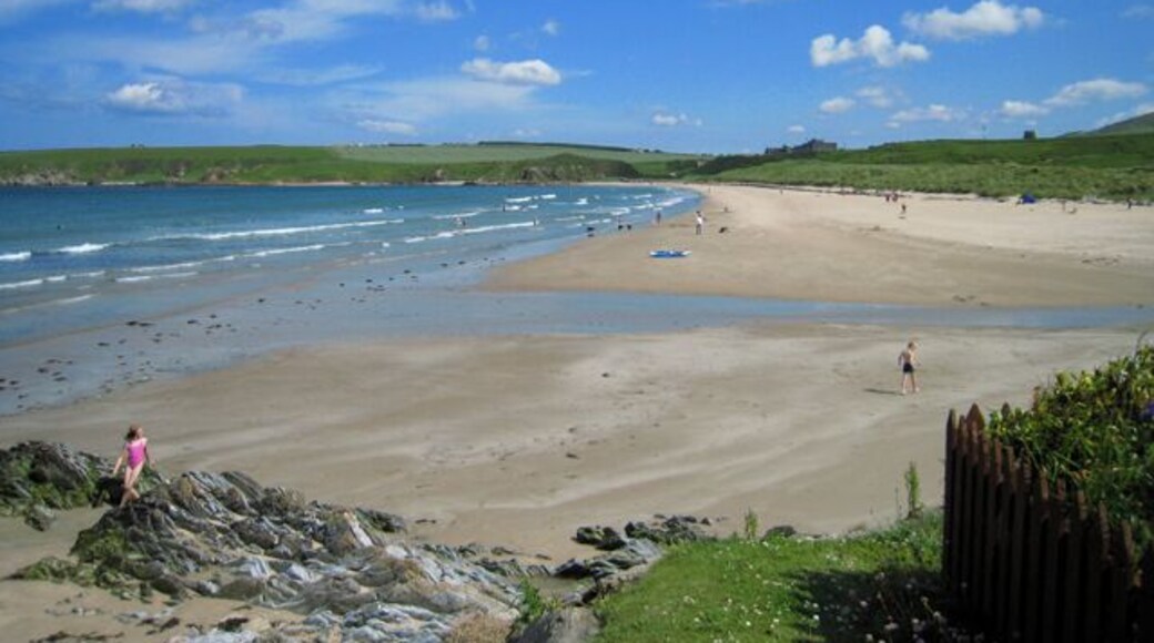 Sandend Bay Sandend lying to the west of Sandend Bay is one of the smallest of the many old fishing villages scattered along the north-facing coasts of Moray and Aberdeenshire. Sandend beach is popular with families and for surfers, especially on a day like this. At its east end, on the horizon, lies Glenglassaugh Distillery which, once again, is producing its distinctive single malt whisky after being mothballed in 1986. In the dark days of the second world war the beach was regarded as being suitable for a landing ground for the Germans and was fortified with a double row of tank traps and a gun emplacement at the east end.