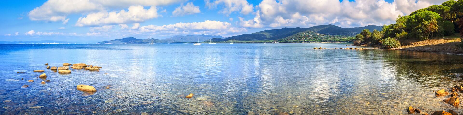Rocks and yachts in a sea bay. Punta Ala, Tuscany, Italy