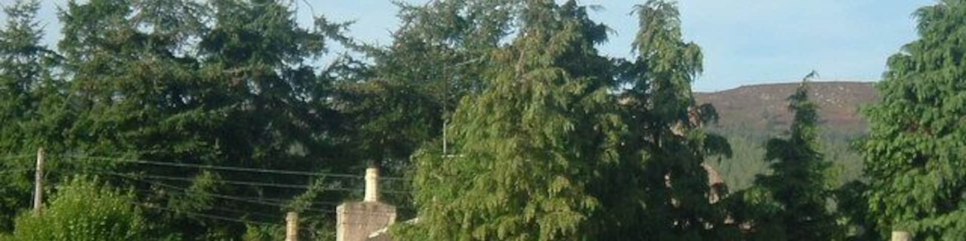 Cottages off A70 South of Hill of Fare; north of Brathens wood.