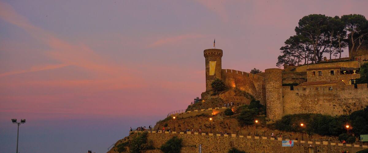 Tossa de Mar is in Costa Brava, Gerona, In the Catalonian shore. Is a beautiful location that not only has the most amazing coves, but great medieval stone town with its castel crowning the skies.