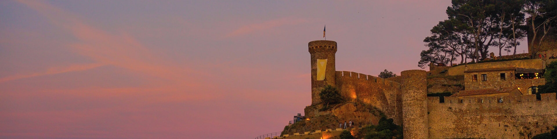 Tossa de Mar is in Costa Brava, Gerona, In the Catalonian shore. Is a beautiful location that not only has the most amazing coves, but great medieval stone town with its castel crowning the skies.
