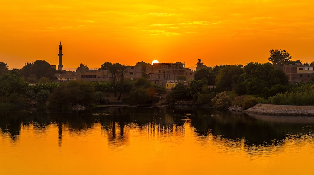 Sunset panoramic sailing on the Nile river cruise. Egypt. Sailing from Luxor to Aswan, view of traditional villages and the nature of the Nile river