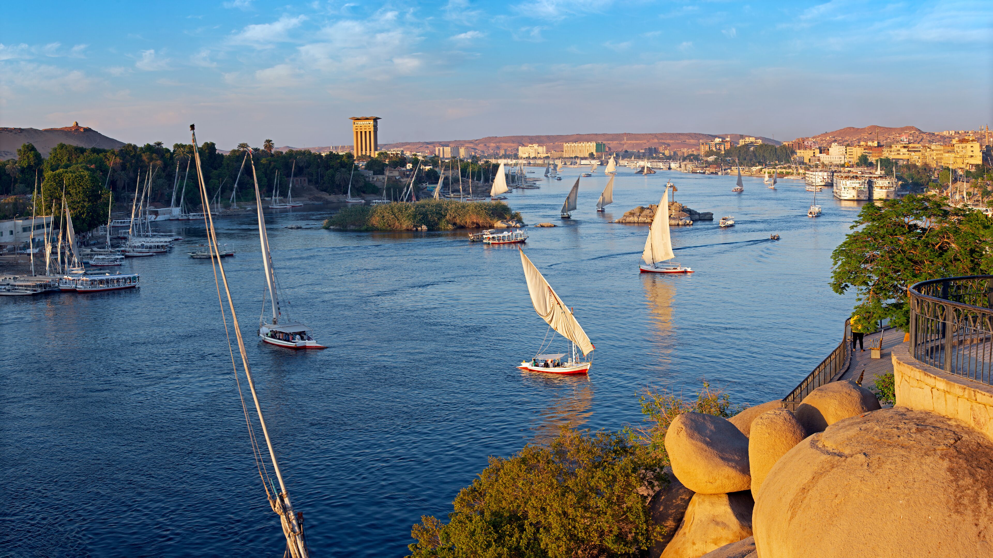 Beautiful panorama landscape with felucca boats on Nile river in Aswan at sunset, Egypt