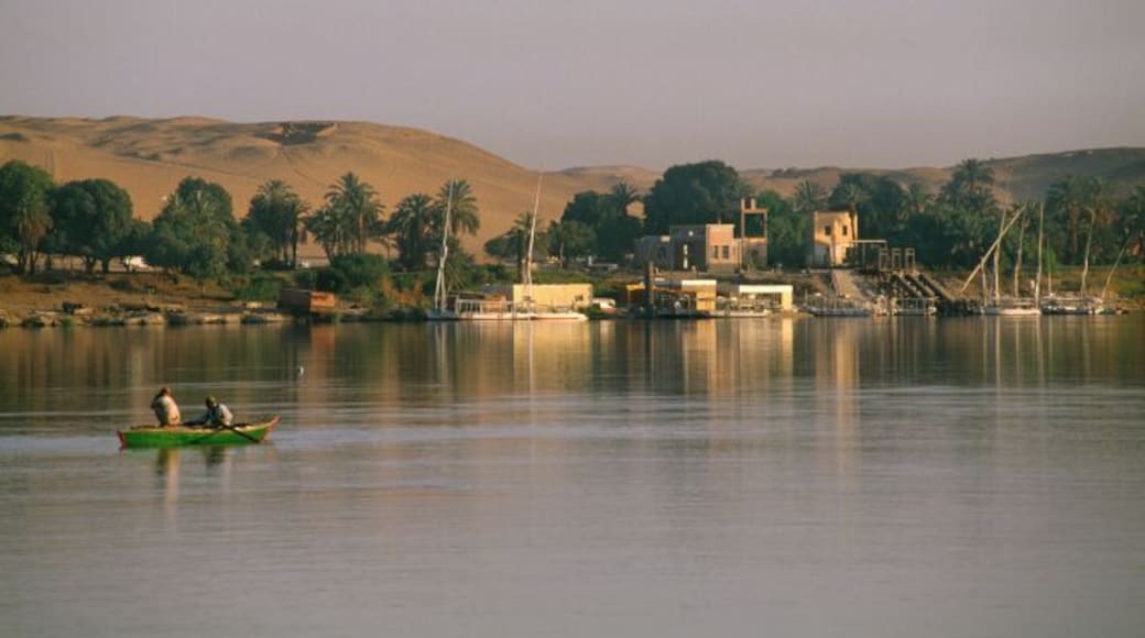 Egypt, Aswan, two fishermen in boat at sunrise