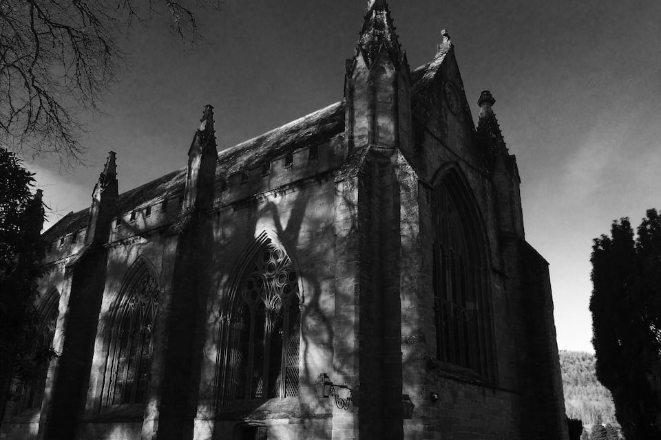 A Gothic-style church with pointed arches and a tall spire.