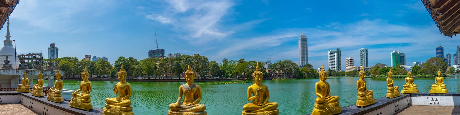 Golden buddha statues at Gangarama Seema Malakaya buddhist temple at Colombo, Sri Lanka