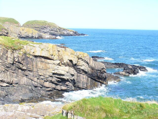 Coastal Scenery North of Collieston Sloping rock strata and skerries give a very interesting and varied littoral.