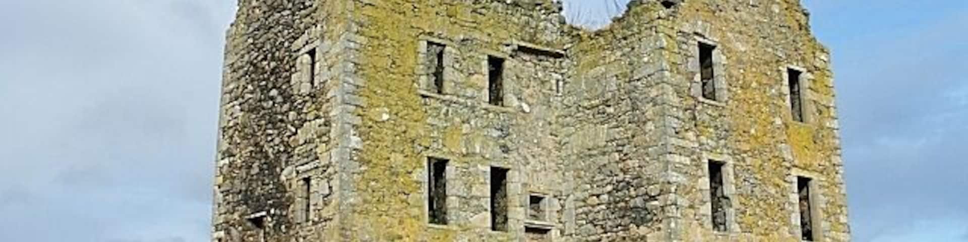 Knockhall Castle Rather a fortified house than a castle, this is an L-plan tower house with an extra wing on the rear. There are gunloops at ground level, and windows only in the upper storeys. The door has been walled up to prevent access.