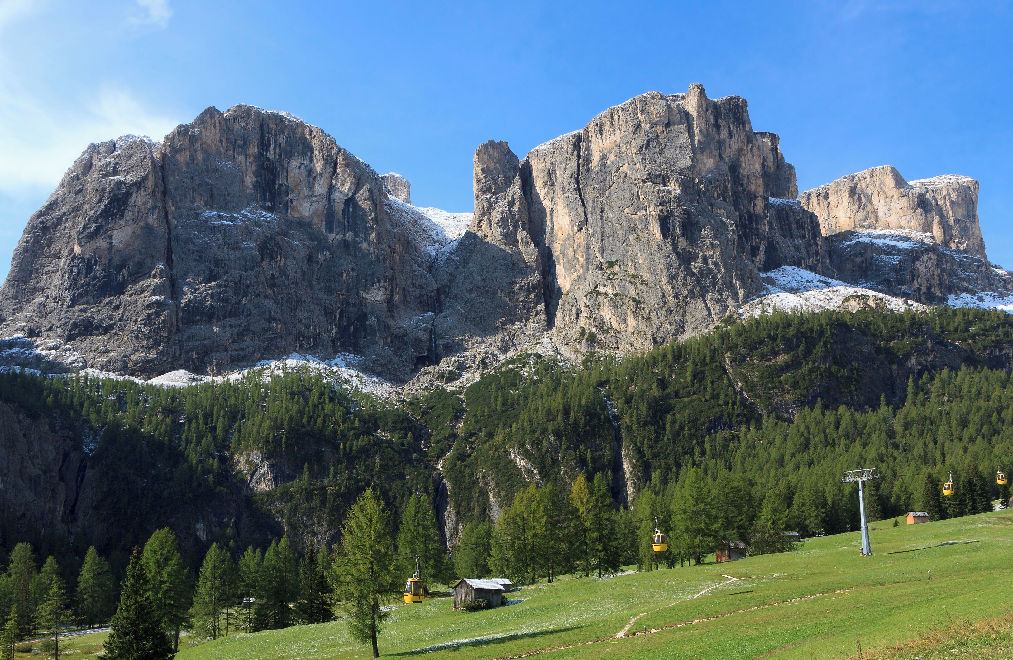Mur Orientale de Pisciadu, Torre Exner, Mur Occidentale de Pisciadu, Torre Campideller and Sas dla Luesa (from left to right) south of the Gardena Pass, Sella group, Dolomites, South Tyrol, Italy with the Plans aerial lift in the foreground.