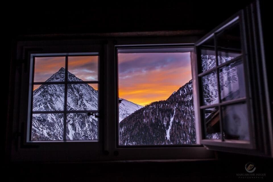 Spectacular sunset 🇨🇭in Saas Fee, Switzerland with a view of the Allalin Horn from historic Chalet Castellino.