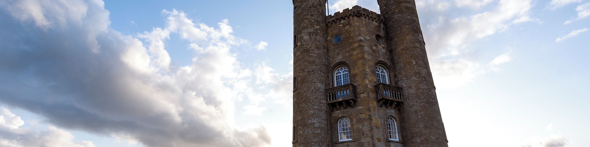Broadway Tower is a folly on Broadway Hill, near the large village of Broadway, in the English county of Worcestershire, at the second-highest point of the Cotswolds (after Cleeve Hill). Broadway Tower's base is 1,024 feet (312 metres) above sea level. The tower itself stands 65 feet (20 metres) high.