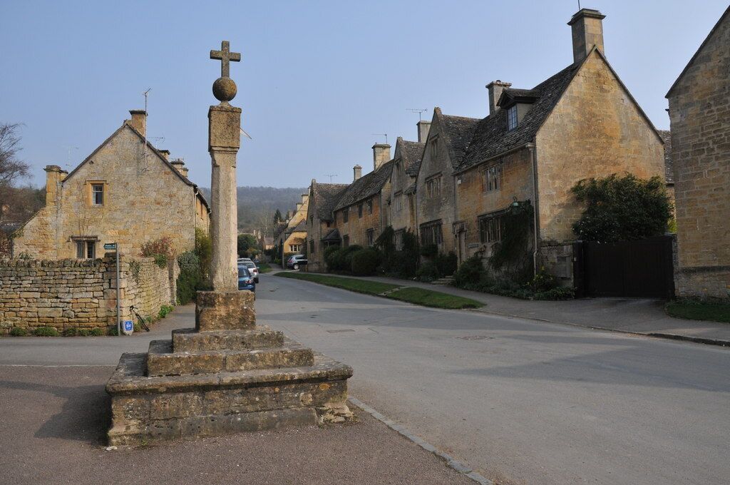 Cross in Stanton. Cross with a sundial on the side of the main street through the village of Stanton.