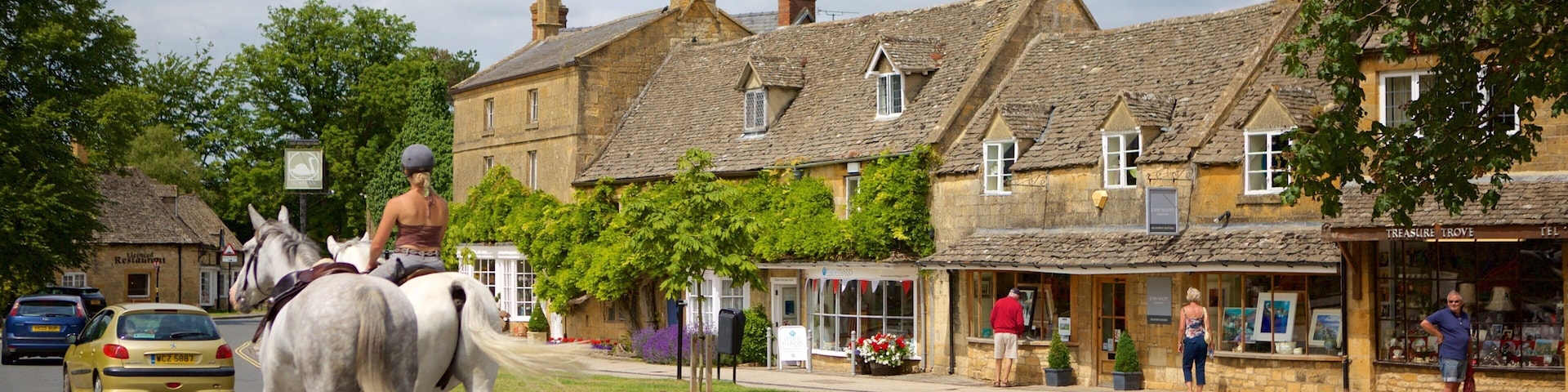 Broadway featuring a small town or village, street scenes and horseriding