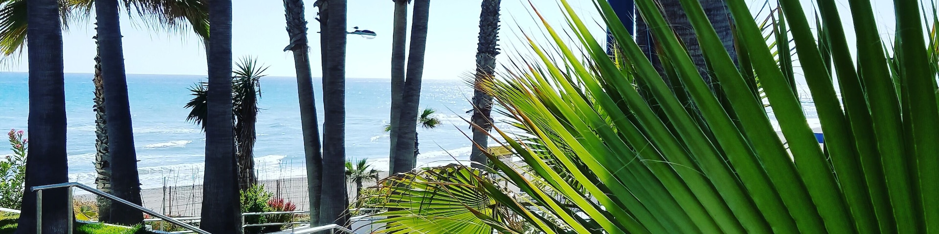Arriving at la playa on dark sand in Torrox