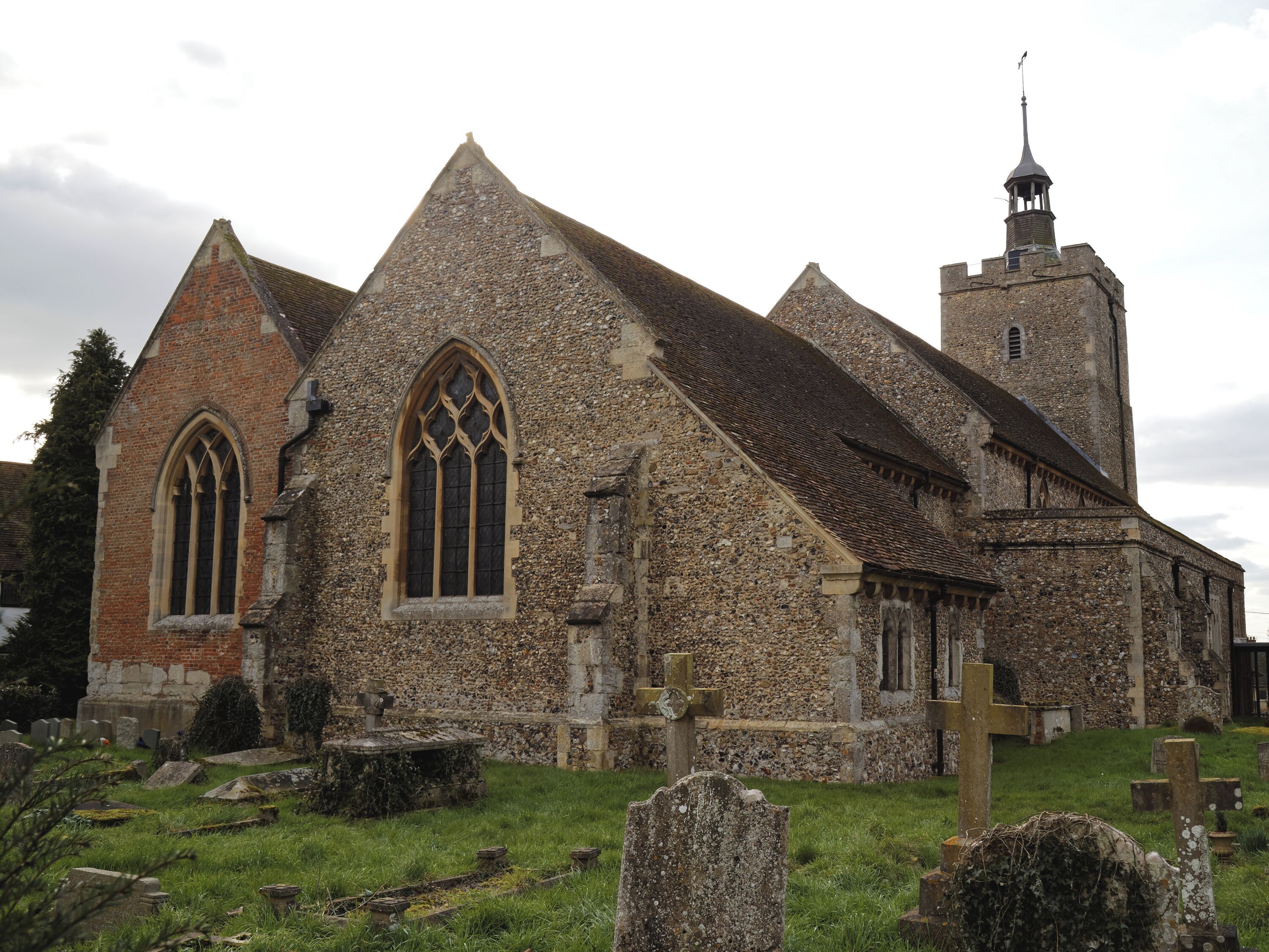 A view from the north-east of the south chapel and chancel of the Grade I listed Holy Cross Church on the B1417 Braintree Road, Felsted, Essex, England. Camera: Canon EOS 6D with Canon EF 24-105mm F4L IS USM lens. Software: large RAW file lens-corrected, optimized and downsized with DxO OpticsPro 10 Elite, Viewpoint 2, and Adobe Photoshop CS2.
