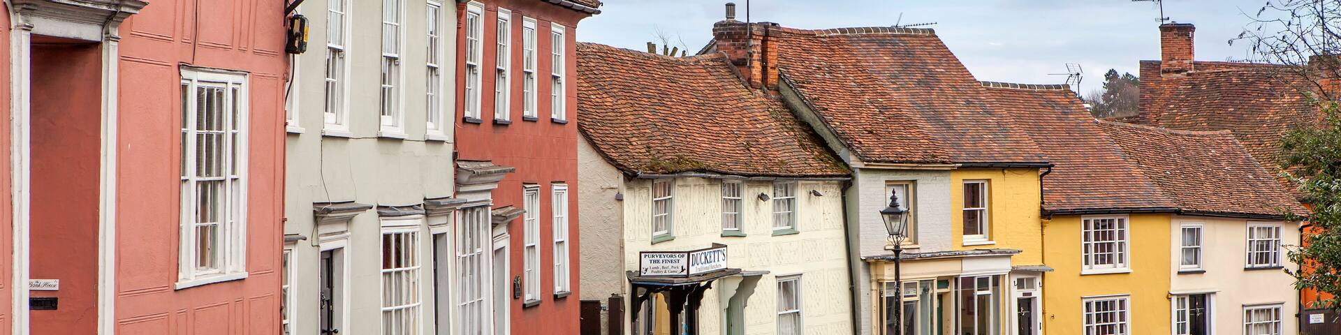 Dunmow, Thaxted, Essex, UK , Great Dunmow is an ancient market town in north-west Essex. Traditional English old street with two-story colorful cottages and tiled roofs